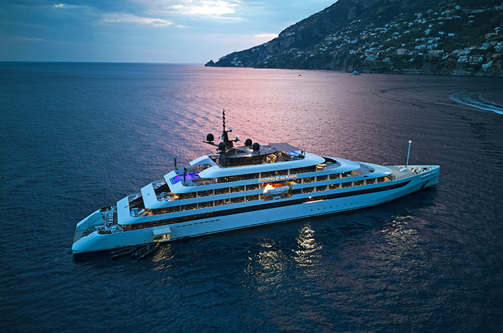 Emerald Sakara cruising at night on the Amalfi Coast