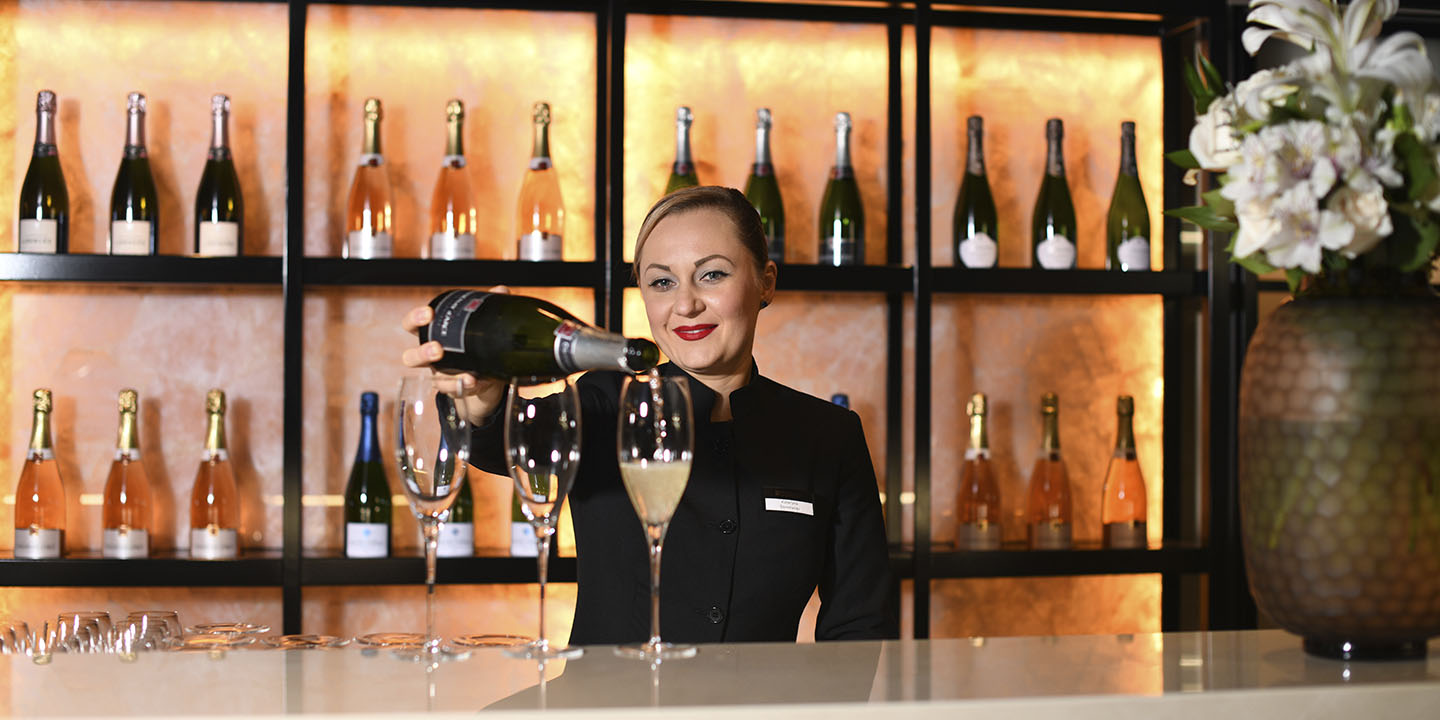 Bartender at Lumière Champagne Bar on Scenic Eclipse I