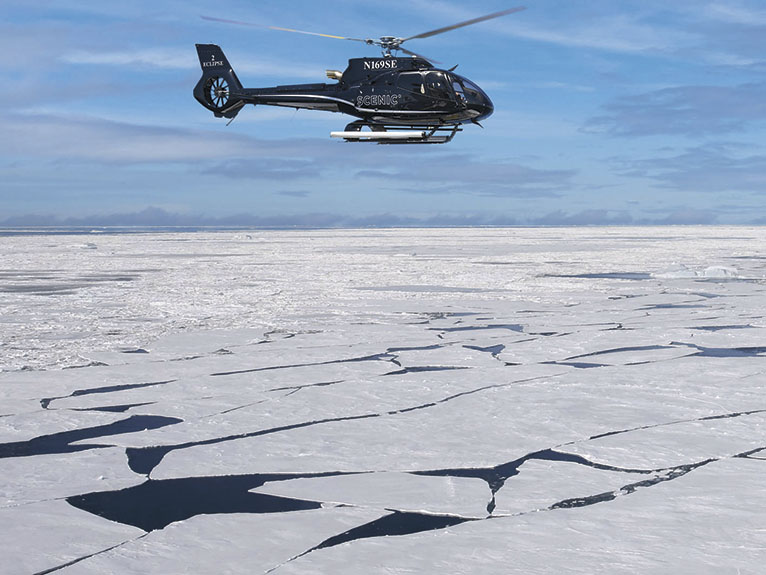 Helicopter^ returning to Scenic Eclipse near Detaille Island, Antarctica