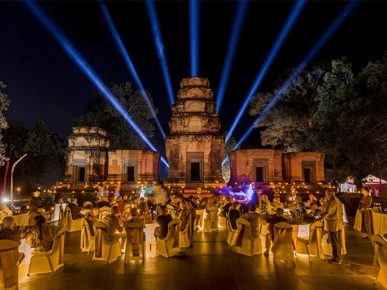 Scenic  guests having dinner in front of Angkor Wat Temple, Cambodia