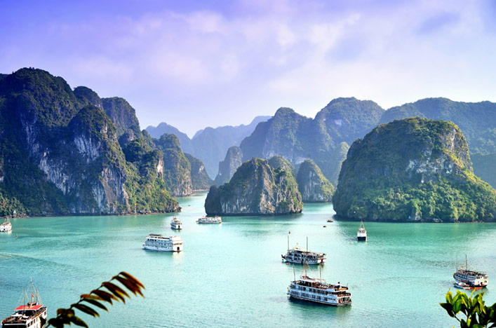 Hạ Long Bay in Vietnam with emerald waters and tall limestone islands
