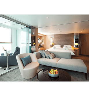 The luxurious lounge area and queen bed in the Royal Panorama Suite on the Scenic Jasper