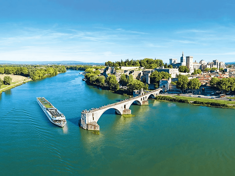 The Scenic Sapphire Space-Ship on the Rhone River. Cruising past the historic city of Avignon on a clear sunny day.