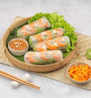 Fresh Vietnamese spring rolls with shrimp, lettuce, and herbs served with hoisin peanut dipping sauce.