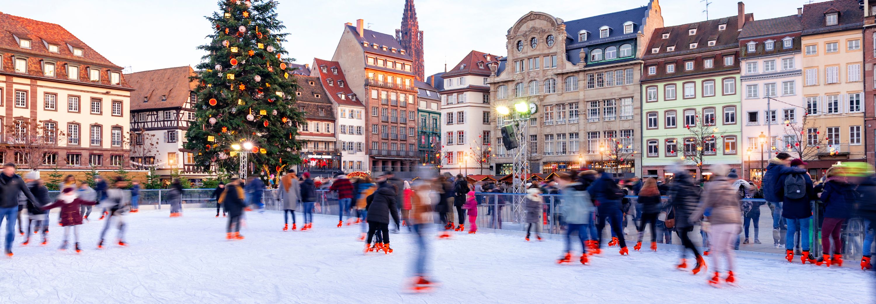 Ice skaters at a Christmas market in Strasbourg, France